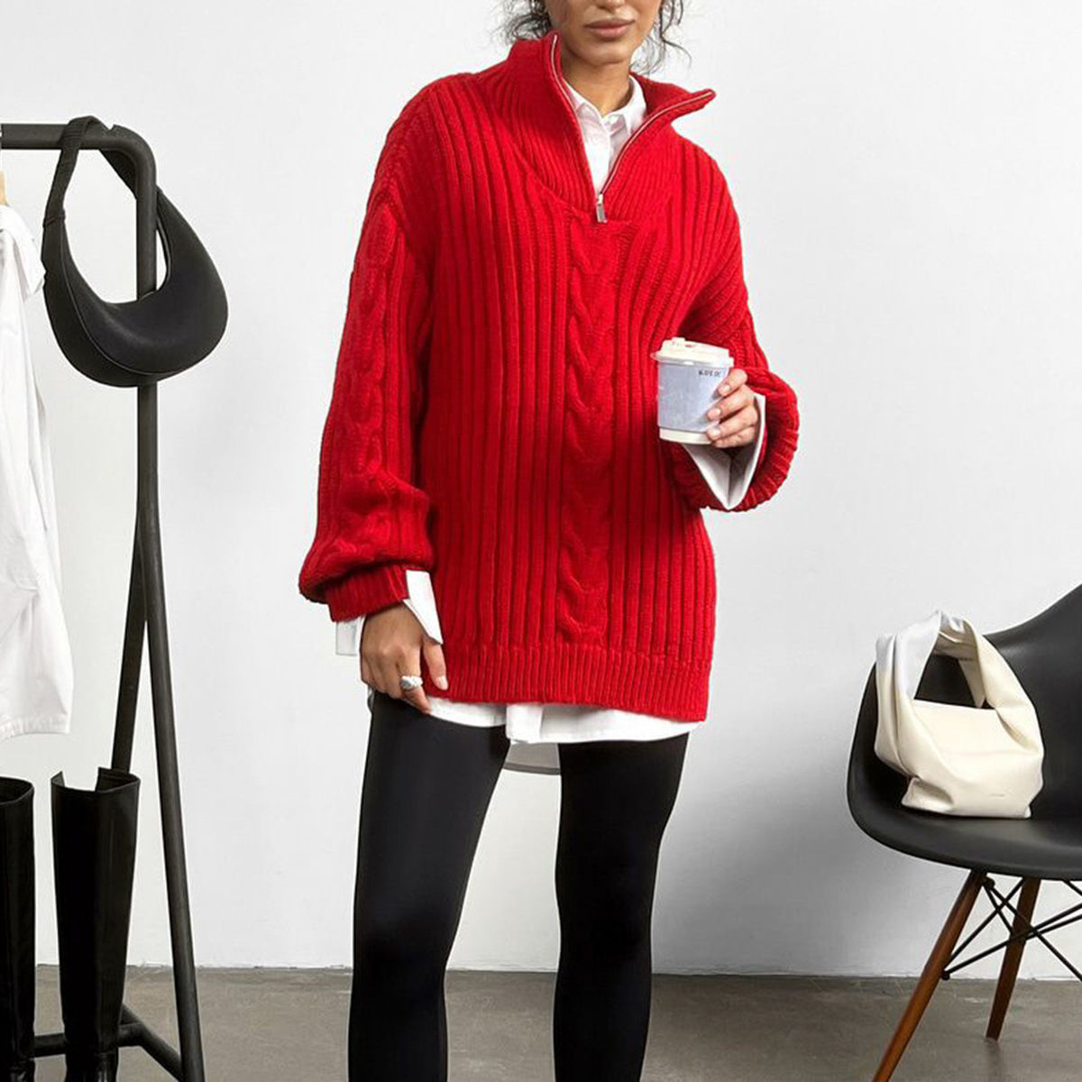 Red cable knit zip-neck sweater with a mock neck, styled with a white shirt and black leggings.