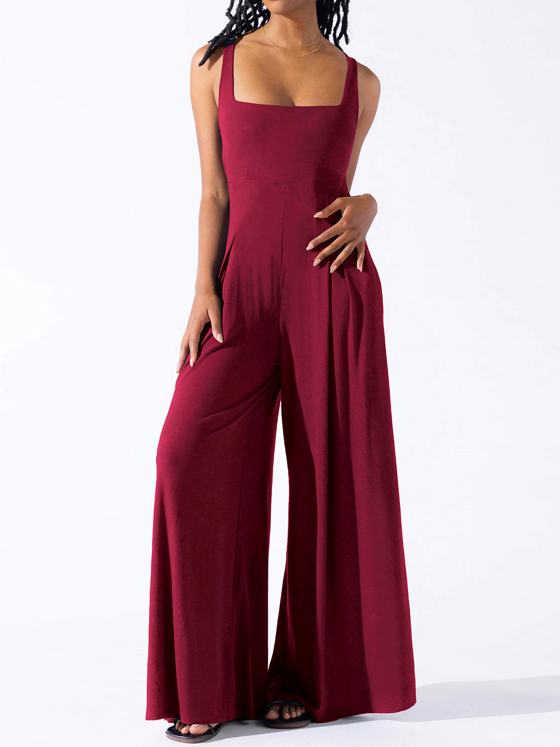 Burgundy square neck palazzo jumpsuit with wide legs and pockets.