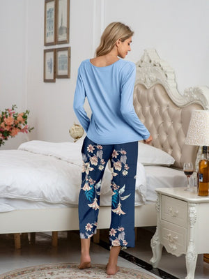 Botanical print lounge set with long sleeve top and cropped pants in dark blue.