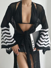Black knit duster with chevron striped bell sleeves and a tie waist.