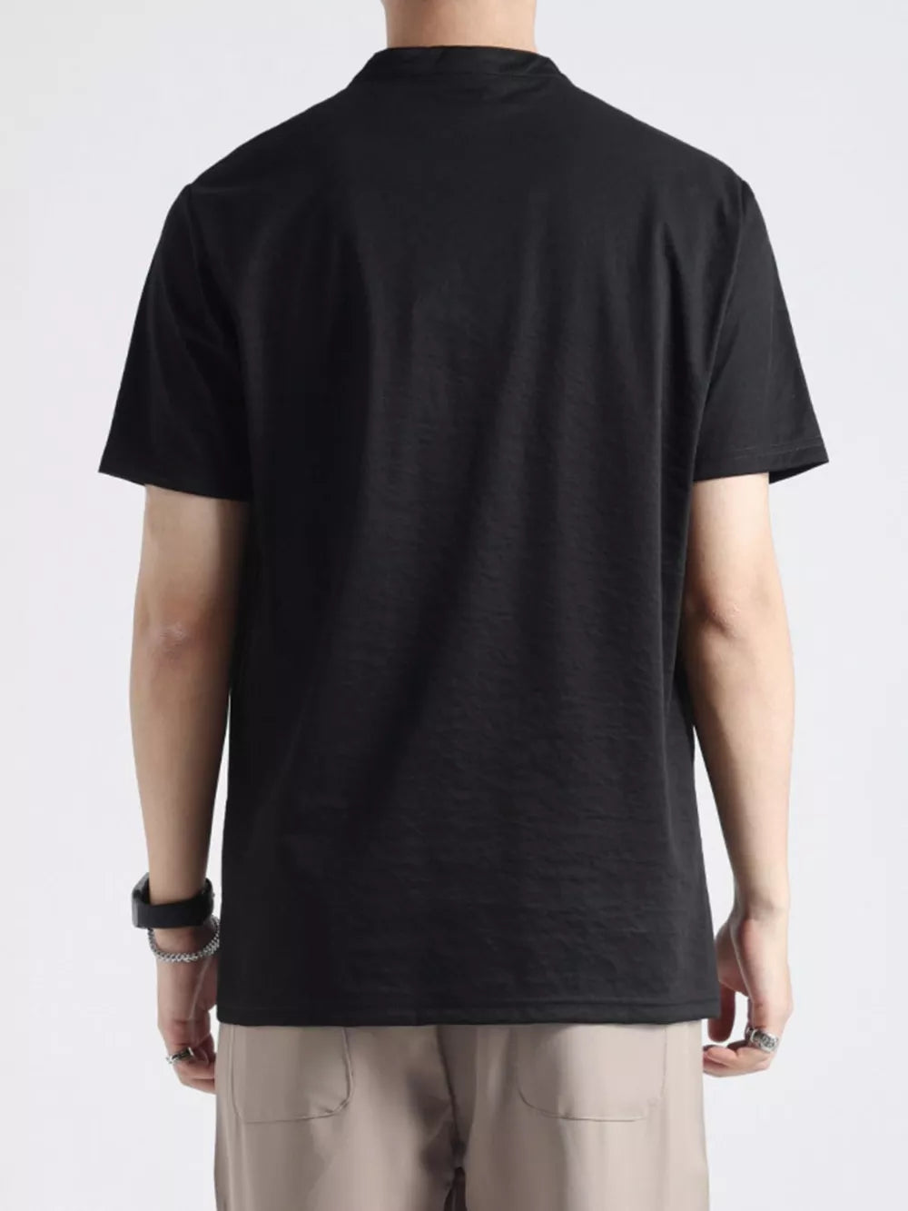 Men's black buttoned henley t-shirt with band collar, short sleeves.