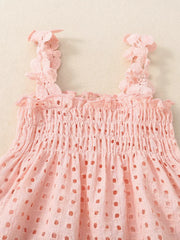 Pink eyelet tank top with smocked bodice and ruffled straps, part of a baby set.