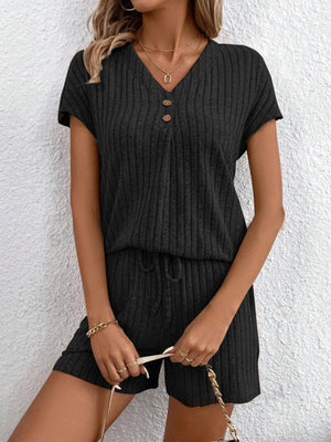 Black ribbed knit lounge set with button-down top and drawstring shorts.