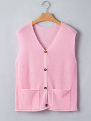 Pink acrylic button front V neck sweater vest with two front pockets.