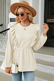 Cream textured peplum blouse with ruffled neckline and long sleeves