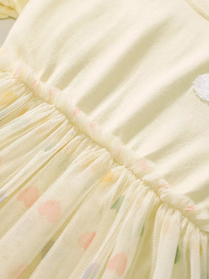 Beige baby dress with rainbow heart applique on tulle skirt and cotton top.