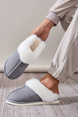 Dark Gray suede house slides with white shearling trim and contrast stitching.
