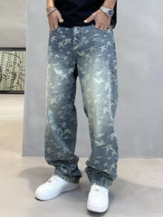 Loose-fit jeans with all-over bird print in washed blue denim