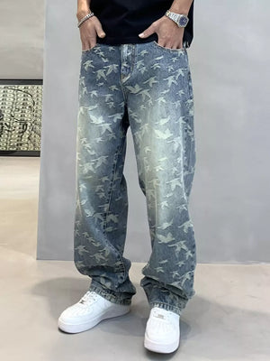 Loose-fit jeans with all-over bird print in washed blue denim