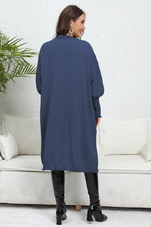 Dark Blue oversized pocketed knit cardigan with long sleeves and a collared neckline.