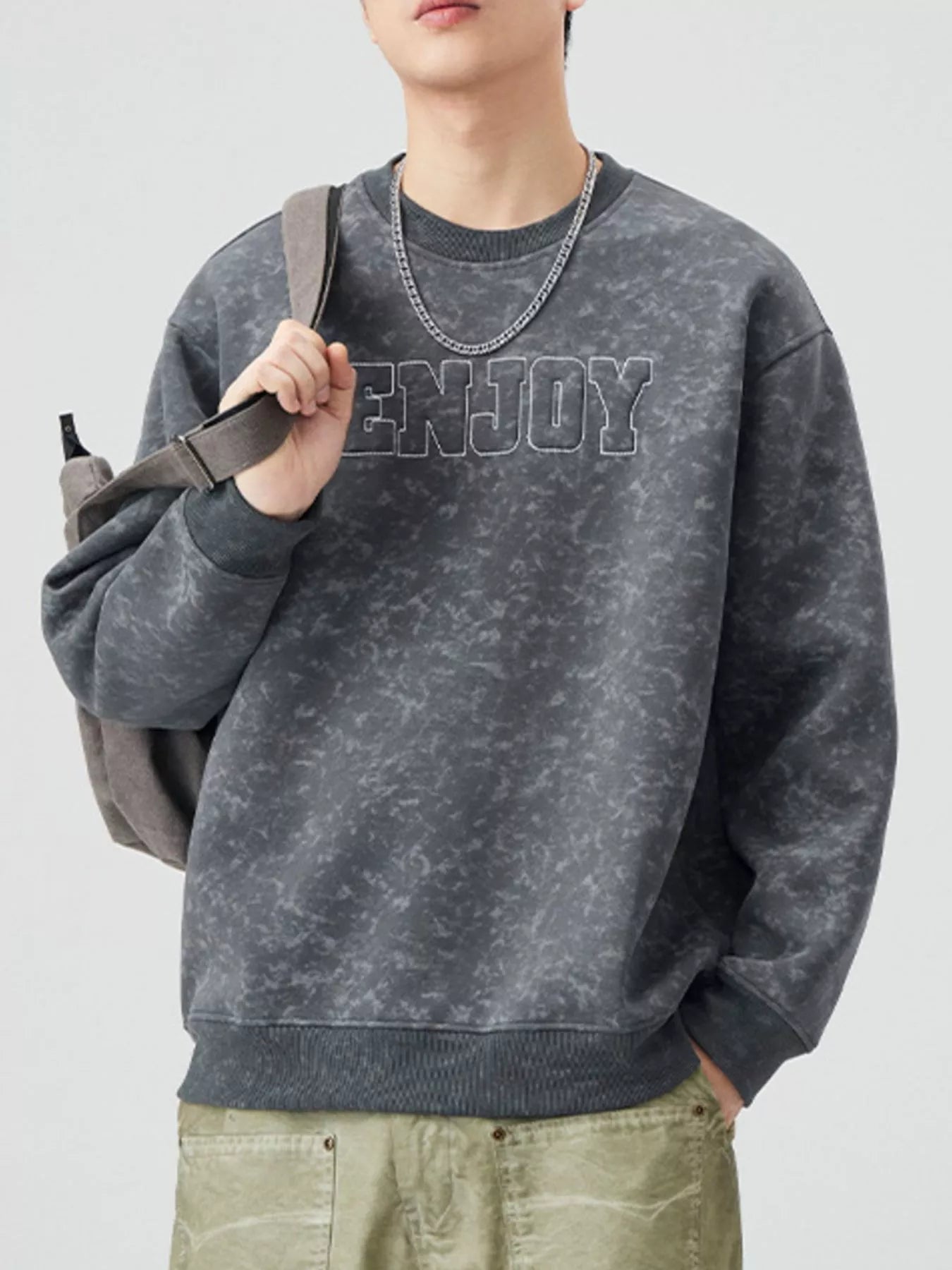 Men's dark gray acid wash sweatshirt with embroidered "ENJOY" text and crewneck.