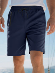 Navy blue chino shorts for men with drawstring waist and zip pocket detail.