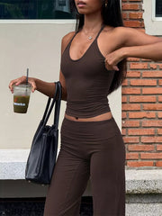 Brown halter crop top and wide-leg pants set with a smooth finish.