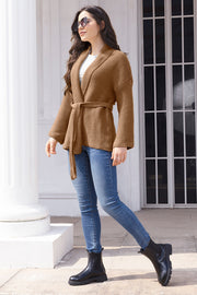 Camel waffle knit belted cardigan with shawl collar and long sleeves