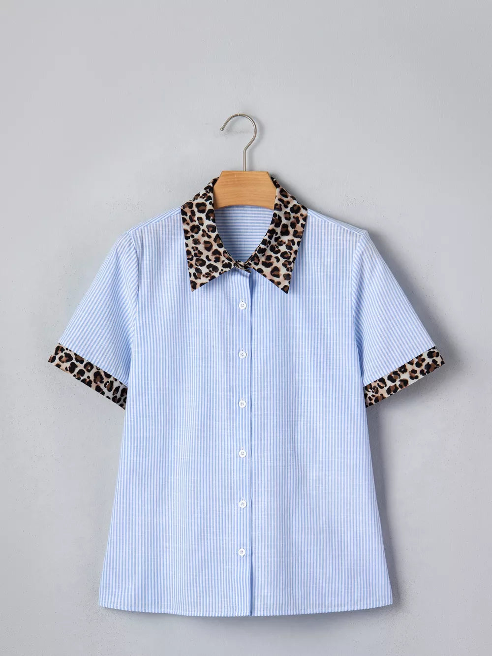 Blue striped button-down shirt with leopard print collar and cuffs