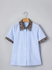 Blue striped button-down shirt with leopard print collar and cuffs