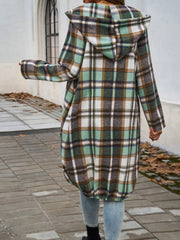 Hooded plaid cocoon jacket in green, brown, and white with a draped silhouette.