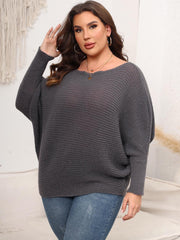 Charcoal ribbed knit off-shoulder sweater with batwing sleeves and a boat neckline.