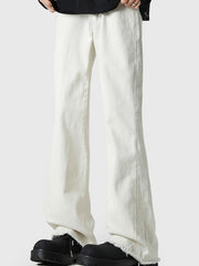 Men's white 100% cotton flare jeans with raw hem detail.