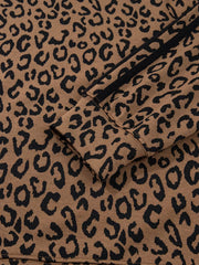 Brown leopard print joggers with black side stripes and drawstring detail.