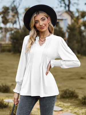 White long sleeve blouse with pleated yoke and shirred cuffs