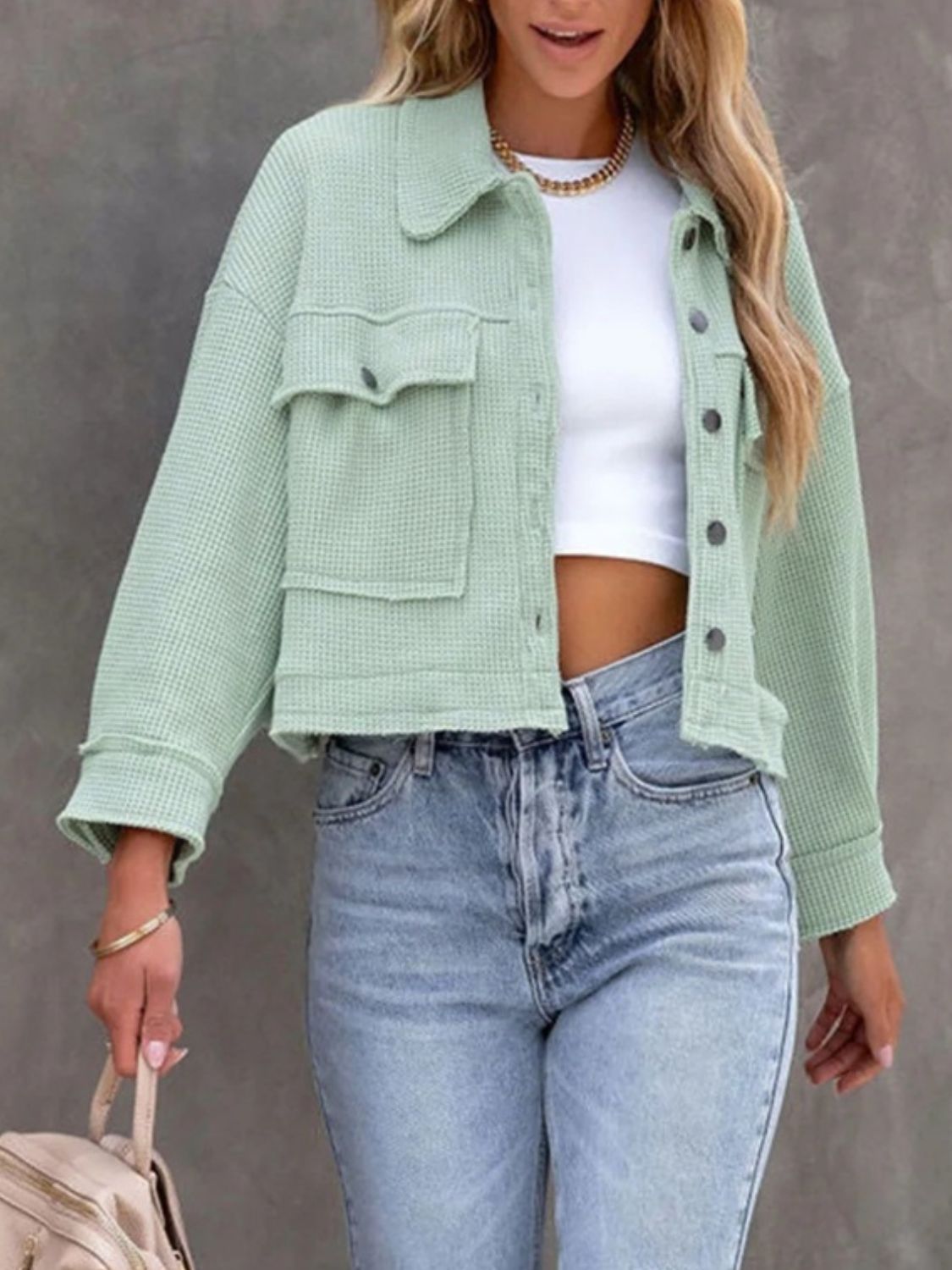 Waffle knit cropped jacket in Moss with buttoned chest pockets and collar.