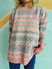 Fair Isle knit oversized sweater in pink with blue and yellow geometric pattern, crewneck, long sleeves, ribbed cuffs and