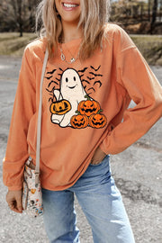 Corduroy crewneck sweatshirt in sherbet with ghost and pumpkin graphic.