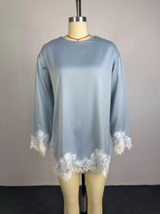 Light blue satin maternity t-shirt with lace trim at hem and cuffs.