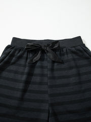 Dark gray striped pajama shorts with elastic waistband and black satin bow detail.