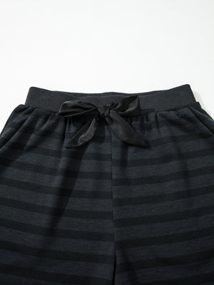 Dark gray striped pajama shorts with elastic waistband and black satin bow detail.
