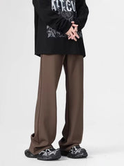 Men's relaxed fit sweatpants in coffee color with pockets, styled casually.