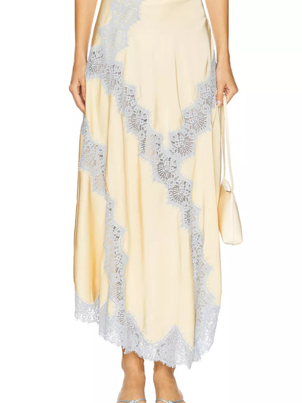 Beige lace cami and skirt ensemble with delicate lace trim and a satin finish.