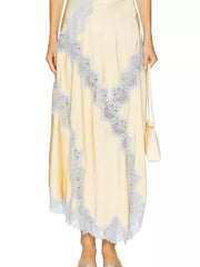 Beige lace cami and skirt ensemble with delicate lace trim and a satin finish.