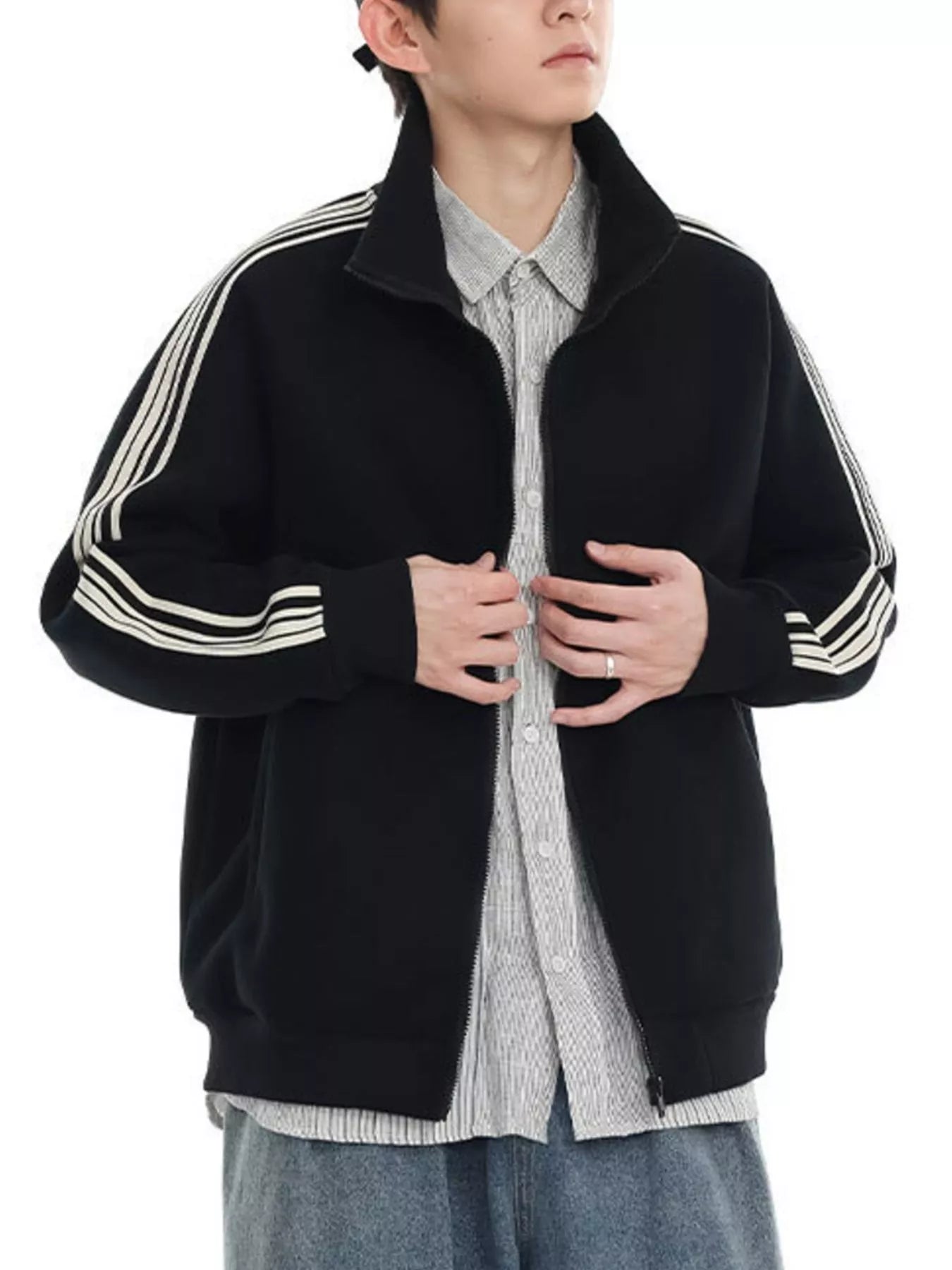 Black zip-up sweatshirt with contrast stripes on sleeves and collar.