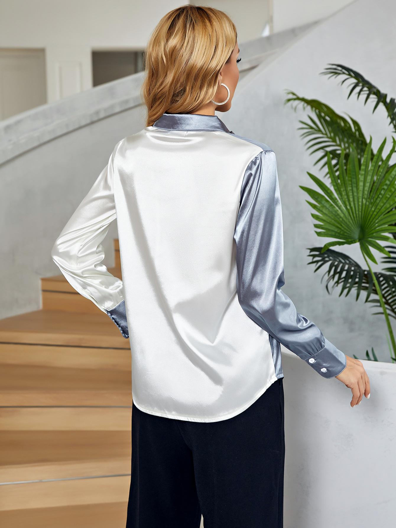 Satin colorblock button-down blouse in white and light blue with button cuffs.
