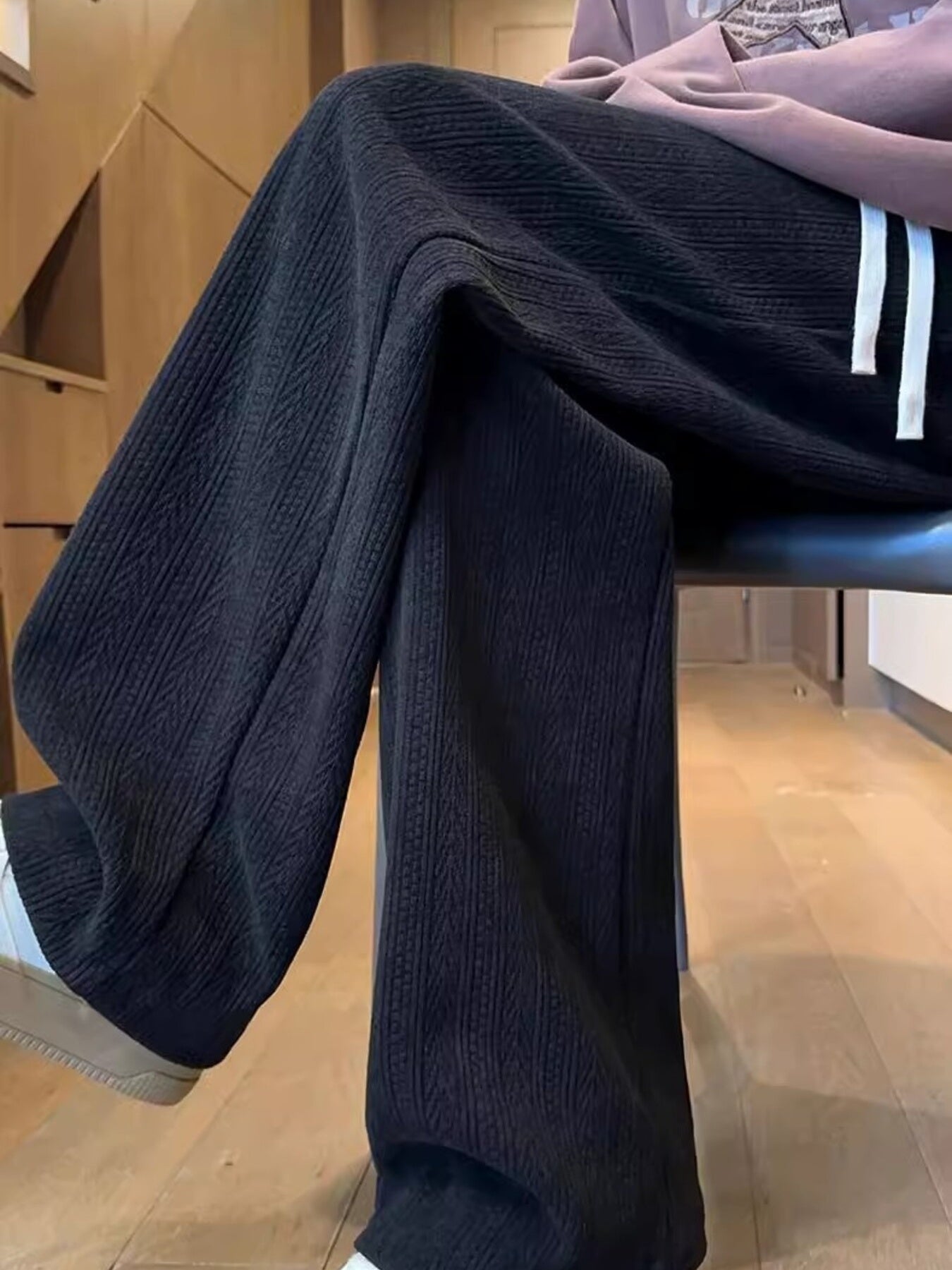 Textured black wide leg sweatpants for men with a relaxed fit.