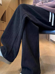 Textured black wide leg sweatpants for men with a relaxed fit.