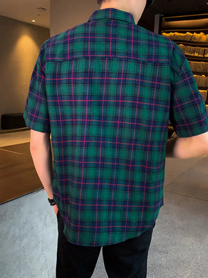 Men's green plaid short sleeve button-down shirt with chest pocket