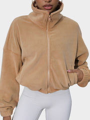 Tan fleece cropped funnel neck jacket with zipper and side pocket detail