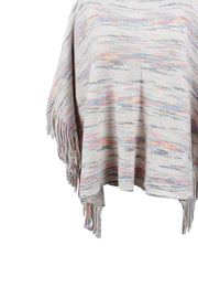 Multicolor knit poncho with fringe detail, featuring horizontal stripes in pastel and gray tones.