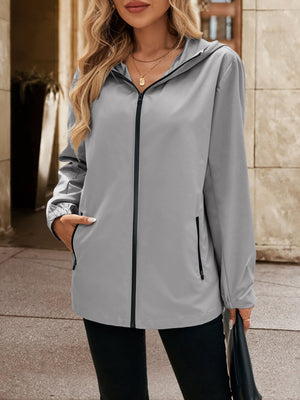 Gray zip-through hooded jacket with black trim and zippered pockets.