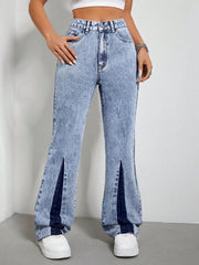 Light acid wash bootcut jeans with split hems and dark blue denim insets.