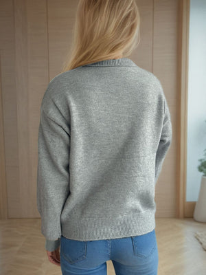 Gray relaxed fit turtleneck sweater with ribbed cuffs and hem.