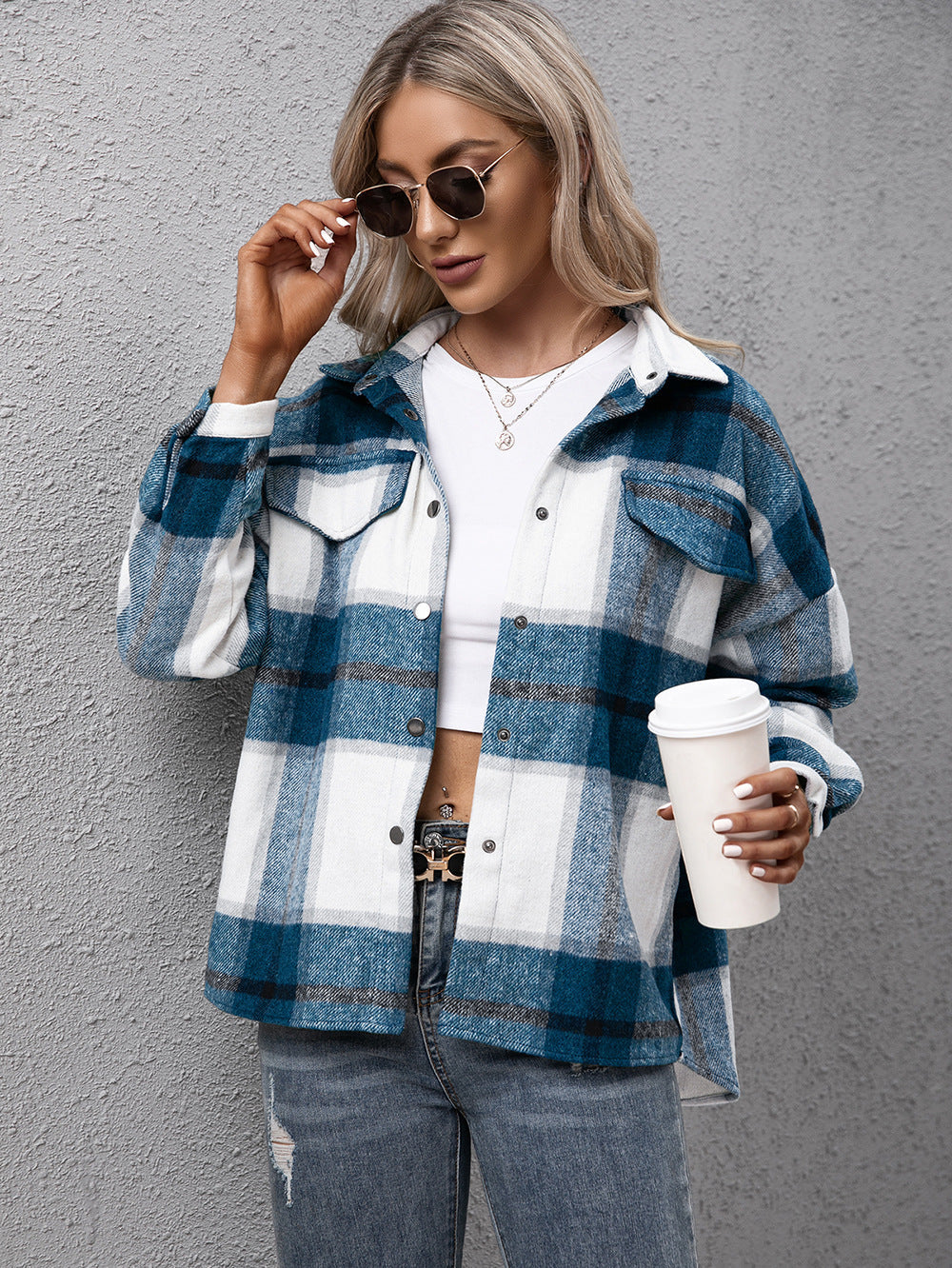 Azure plaid oversized button-up shirt with white and dark blue checks, featuring two chest pockets.