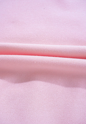 Blush pink off-shoulder sweatshirt with soft fabric texture