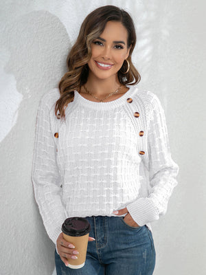White textured crewneck knit sweater with button detail on shoulder