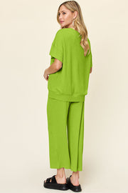 Lime waffle knit lounge set with short sleeve top and wide leg pants.