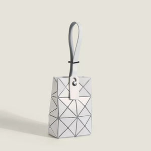 White geometric panel mini tote bag with a single strap.
