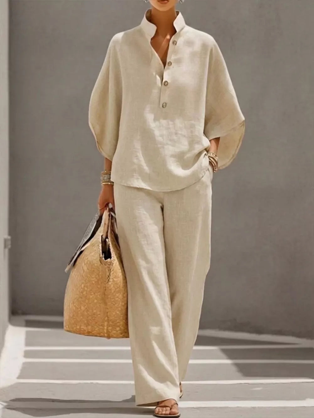 Chic buttoned loungewear set in apricot, featuring a stand collar, half sleeves, and wide-leg pants.